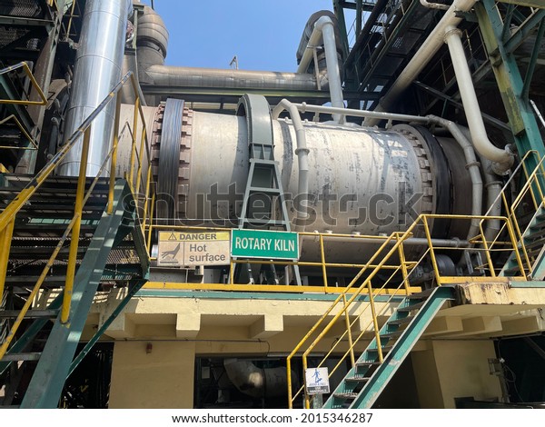 A rotary kiln is a pyro-processing device that\
raises materials to very high temperatures in a continuous process.\
It is used to create cement, lime, metakaolin, titanium dioxide,\
alumina and iron.
