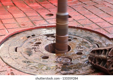 Rotary Table While Drilling Oil Well And Pipe Being Rotated And A Slip On The Floor