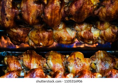 Rotating chicken at street food - Shutterstock ID 1105316906
