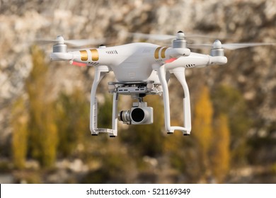  Rotating drone on background of mountains / Drone in the air 