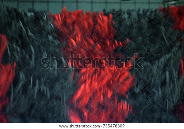 rotating flap System in a car wash, Abstract car\
wash in red and black