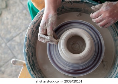 Rotating Potter's Wheel View From Above And Hands In Clay. Hobby To Create Pottery