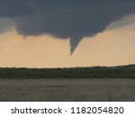 A rotating wall cloud and funnel cloud are the prelude of a storm that would soon produce a large tornado. Taken in the Texas panhandle. 
