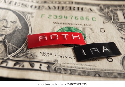 Roth IRA labels macro on a dollar bill                               