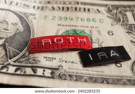 Roth IRA labels macro on a dollar bill                               