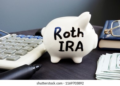 Roth IRA Written On A Piggy Bank. Retirement Plan.