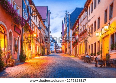 Rothenburg ob der Tauber, Germany. Schimedgasse street and Marktplatz, historical downtown of Rothenburg. Charming city on Romantic Road, Bavaria travel destination.