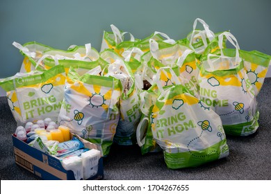 ROTHERHAM, UK - APRIL 14, 2020: Donations At A Trussell Trust Local Church Food Bank In Carrier Bags And A Box