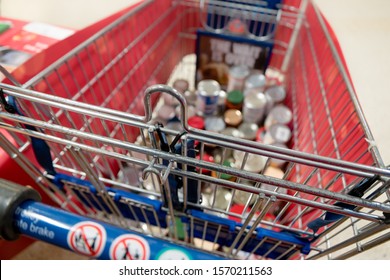 ROTHERHAM, UK – NOVEMBER 22, 2019: A Shopping Trolley With Donated Tins At The National Food Bank Collection For Trussell Trust Foodbanks