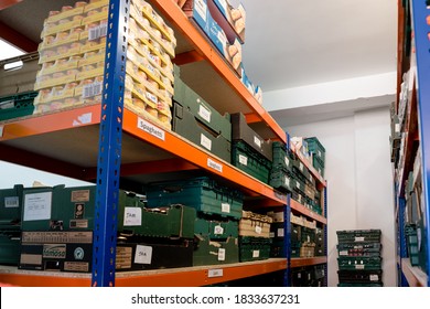 ROTHERHAM, UK – SEPTEMBER 29, 2020: Crates And Shelves Of Donated Food Organised By Date In A Trussell Trust Foodbank Warehouse To Give To Families In Need