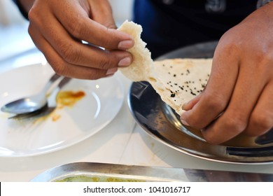 Roti Handle.Men Are Tearing Roti Flour To Eat. Cheese Naan.Made From Roti Flour. Is A Food Of Thai Muslims From India.at The Restaurant. Concept :Muslim Food Or Halal Food