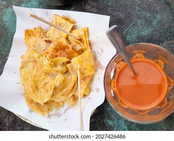 Roti And Hot Thai Tea On Green Table