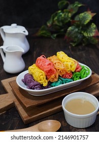 Roti jala, roti kirai or roti renjis or net bread or lace pancake.  a popular Malay and Minangkabau tea time snack served with curry dishes or sweet compote. Colorful