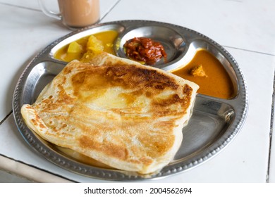 Roti Planta Is Popular Breakfast In Malaysia. It Is Roti Canai With Added Margarine.