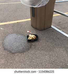 Rotisserie Chicken In Black Container In Parking Lot