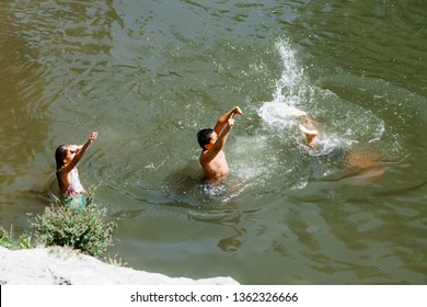 ROTORUA, NEW ZEALAND – JANUARY 7, 2009: Maori Children Penny Diving In Hot Pool In Rotorua, New Zealand.