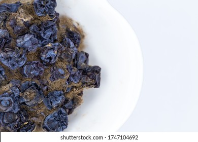 Rotten Berries In The White Bowl