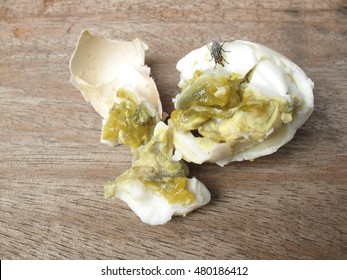 Rotten Eggs On Wooden Table