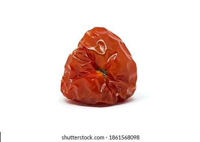 Rotten Red Cherry Tomato On Whote Background. Studio Shot Of A Vegetable