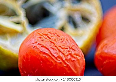 Rotten Vegetables On Black Background