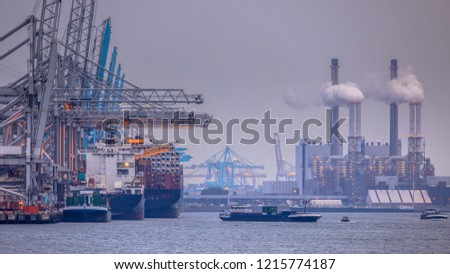 Rotterdam europoort industrial harbor landscape with unloading ships and working factories