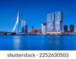 Rotterdam, Holland. View of the Erasmus Bridge and the city center. Panoramic view. Cityscape in the evening. Skyscrapers and buildings.