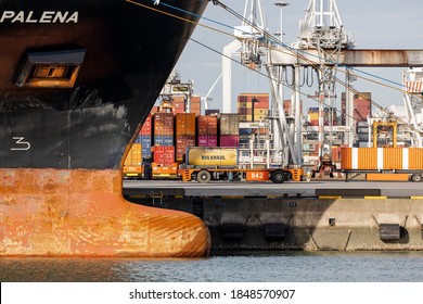 Rotterdam, Netherlands - 11-05-2020: Automated Guided Vehicle AGV Carrying A Bulk Container To A Ship In The Port Of Rotterdam