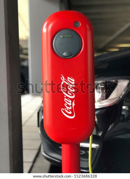 Rotterdam,\
Netherlands - 26 SEPTEMBER 2019:Charging stations for electric cars\
in the Coca Cola Netherlands parking\
lot.