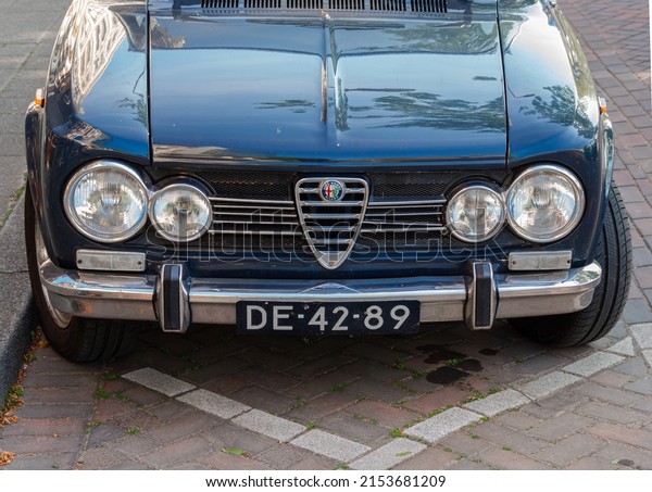 Rotterdam, Netherlands - April\
28, 2022: Vintage Alfa Romeo front grille with old Dutch license\
plate