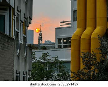 Rotterdam, Netherlands - August 2, 2024: Sunset with a church spire in the foreground seen in Rotterdam in the Netherlands
 - Powered by Shutterstock