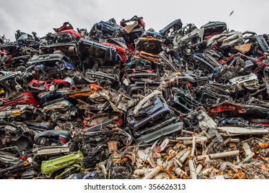 ROTTERDAM, NETHERLANDS - AUGUST 27, 2015: Piled up compressed cars as industrial background. Rotterdam - Netherlands. - Shutterstock ID 356626313