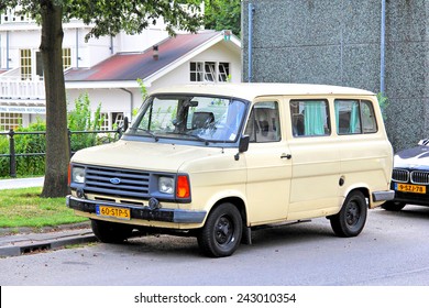 ROTTERDAM, NETHERLANDS - AUGUST 9, 2014: Beige Retro Van Ford Transit At The City Street.