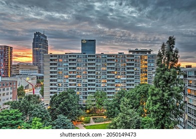 Rotterdam, The Netherlands, July 10, 2016: Little Park In Lijnbaan Neighbourhood Surrounded By Residential Buildings From The Post-war Reconstruction Era At Twilight