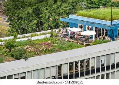 Rotterdam, The Netherlands, June 2, 2019: section of the Dakakker (Rooftop Field) with a flower garden and a cafe on top of a 1960's office building