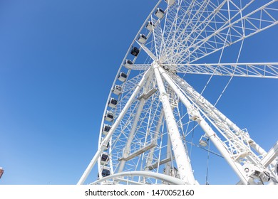 Rotterdam, Netherlands. June 27, 2019. Markthal Park, Ferris Wheel Low Angle Perspective View, Spring Sunny Day. Clear Blue Sky, Copy Space