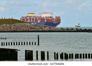 Rotterdam, The Netherlands - Sept 2019; Spectatorson The Breakwater At The Entrance Of Rotterdam Harbor Watching The Largest Container Ship In The World, MSC Gulsun, Entering 