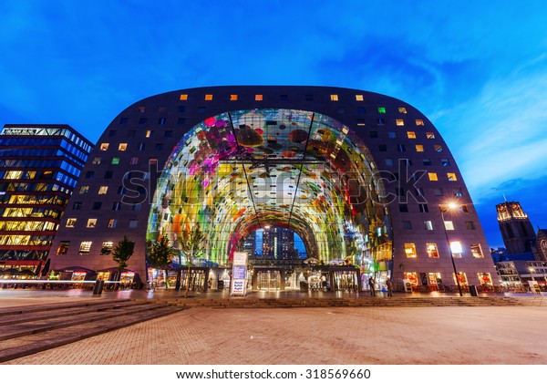 ROTTERDAM,\
NETHERLANDS - SEPTEMBER 03, 2015: modern market hall in Rotterdam\
at dawn. It was opened Oct 1, 2014 by Queen Maxima, designed by\
architect firm MVRDV. With unidentified\
people