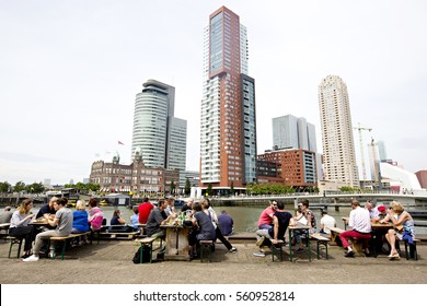 ROTTERDAM, THE NETHERLANDS - SEPTEMBER 2016: People Enjoying The Outside Terraces Of The Fenix Food Factory With The Rotterdam Skyline In The Background