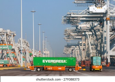 ROTTERDAM - OCT 1, 2011: Robot truck with containers in the ECT Terminal in the port of Rotterdam. This port is the Europe's largest and facilitate the needs of a hinterland with 40,000,000 consumers.