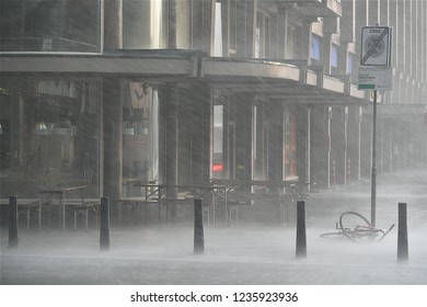 Rotterdam,Netherlands-07 26 2018:Forgotten Bicycle Under Heavy Rain Storm In Rotterdam.