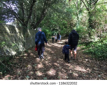 Rottingdean, UK - September 2018 Parents Walking Kids To And From School Along Lovely Tree Tunnel Bridle Path. A Walk To School And Back In The Wood