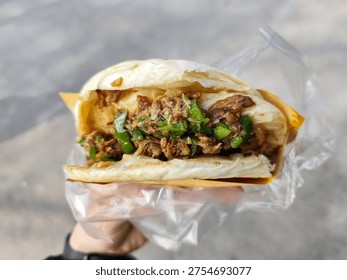 Rou jia mo, often called Chinese Hamburger, a popular Chinese street food from Xian, Shaanxi province, China