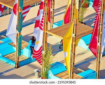 ROUEN, FRANCE - JUNE 8, 2019. Colorful Wooden Terrace With Table, Chairs And Flags, Ready For A Street Cafe Or Restaurant, During The Aramda Time, International Meeting For Sailboats. Aerial View