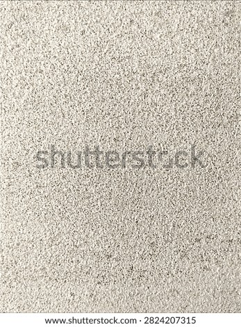 a rough, beige-textured stippled wall surface.