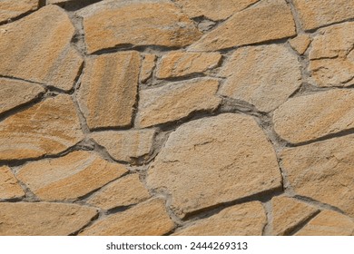Rough brown stone texture abstract mosaic pattern floor wall rock background solid seamless structure.