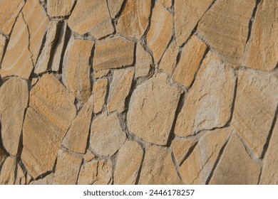 Rough brown stone texture abstract mosaic pattern floor wall rock background solid seamless structure backdrop.