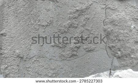 Rough Cement Plaster Texture with Cracks. Weathered cement plaster surface with visible cracks and coarse concrete texture background