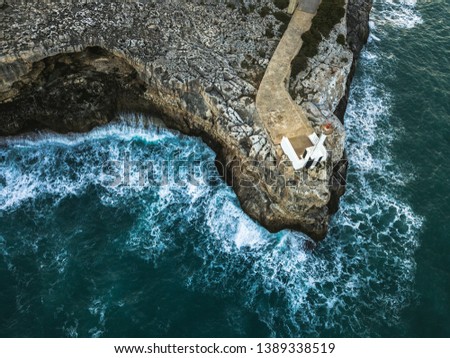 Similar – Aerial Drone View Of Dramatic Ocean Waves Crushing On Rocky Landscape