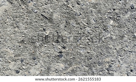 rough concrete and stone texture background, a natural and gritty surface for industrial and urban design projects