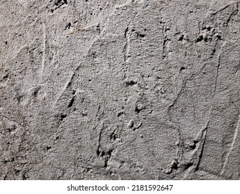 Rough Concrete Wall For The Background. Cement Wall Texture For The Background. Covering The Foundation Of House Walls With Cement Plaster. Grey Surface For Design. 